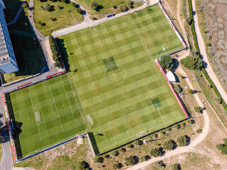 Canvas Print - Aerial view of a complex with football field in Seixal township along Tagus river, Setubal, Portugal