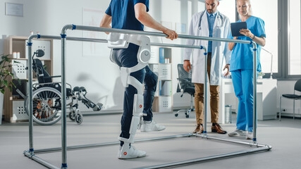 Aufkleber - Modern Hospital Physical Therapy: Patient with Injury Walks Wearing Advanced Robotic Exoskeleton. Physiotherapy Rehabilitation Scientists, Engineers use Tablet Computer to Help Disabled Person