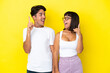 © luismolinero - Young mixed race couple isolated on yellow background intending to realizes the solution while lifting a finger up