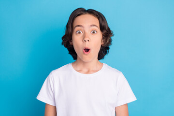 Sticker - Photo of shocked excited funny schoolboy look camera open mouth wear white t-shirt isolated blue color background