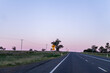 © Austockphoto - Bend in road coming up with recommended speed of 85 kph