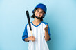 © luismolinero - Baseball mixed race player woman with helmet and bat isolated on blue background shaking hands for closing a good deal