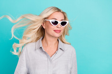 Poster - Profile photo of sincere positive lovely lady look empty space wear sunglass grey shirt isolated teal color background