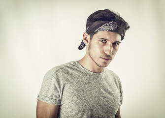 Wall Mural - Handsome green eyed young man with bandanna