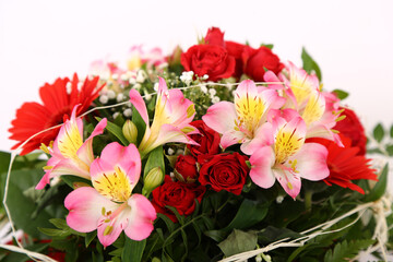 Wall Mural - Closeup shot of a bunch of flowers with beautiful decorations on a white background