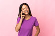 © luismolinero - Caucasian girl isolated on pink background keeping a conversation with the mobile phone with someone