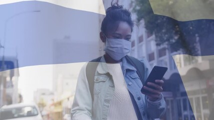 Sticker - Animation of flag of finland waving over woman in face masks