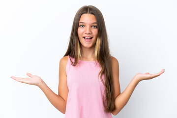 Little caucasian girl isolated on white background with shocked facial expression