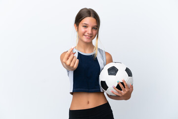 Wall Mural - Little caucasian girl playing football isolated on white background doing coming gesture