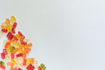 Wall Mural - Overhead shot of tasty gummy bears on a white background - space for your content