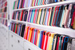 © JackF - Different mobile phone cases on shelves in a multimedia store