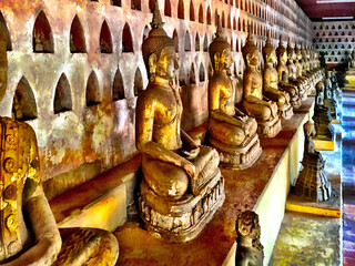 Poster - Closeup shot of golden Buddha statues in Wat Si Saket Temple in Laos