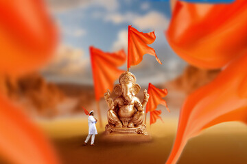 Wall Mural - Golden lord ganesha sculpture with orange flag