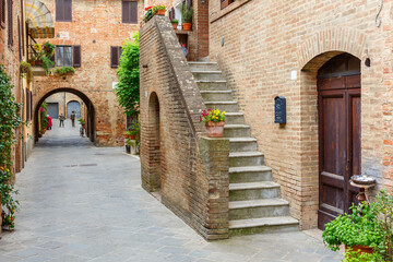 Canvas Print - Alley with arches and a staircase in a backyard