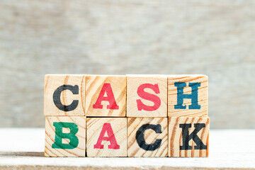 Poster - Alphpabet letter block in word cash back on wood background