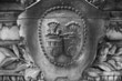 An ancestral coat of arms on the tombstone plinth in the historic Powązki Catholic cemetery in Warsaw,