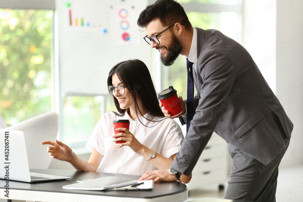 Business people having coffee break in office
