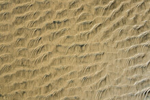 Sand Texture., Marks In The Sand On The Beach When The Tide Goes Out