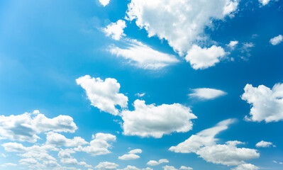 Wall Mural - Stunning view of a blue sky with some clouds during a sunny day. Natural background with copy space