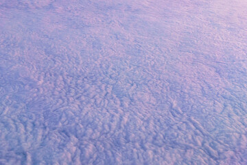 Wall Mural - Clouds background view from the plane. White beautiful clouds top view texture