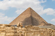 Giza, Egypt - April 21, 2020: The pyramid of Khufu and the Great Sphinx of Giza, Egypt