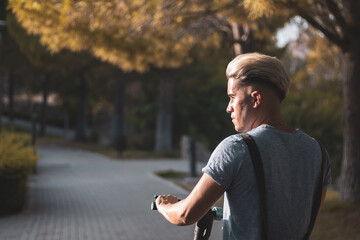 Wall Mural - A gay boy stops his scooter to think about his problems because he has depression.
Anxiety.