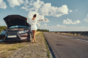 Wall Mural - Female trying to catch a car on road