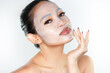 © Pratiwi - A beautiful Asian woman wearing a collagen face mask. Skincare concept, anti-aging moisturizing mask, hydrogel face mask, cosmetology.