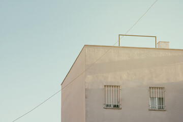 Poster - Urban architecture. Close up of  a rooftop building with sky.