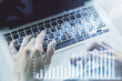 © Pixels Hunter - Multi exposure of abstract financial graph with hand typing on laptop on background, financial and trading concept
