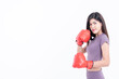 © Anatta_Tan - Portrait images of Asian attractive woman Wearing red boxing gloves, is good shape, On white background, concept to people sport recreation and health care concept.