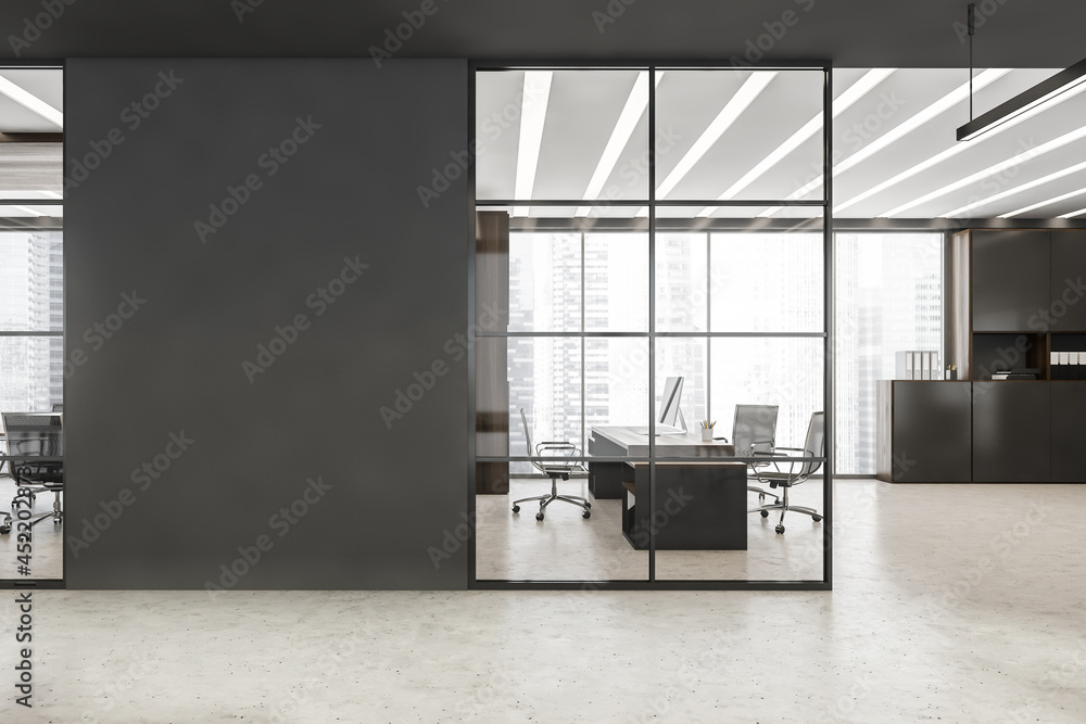 Black framed glass wall with grey detail near office entrance - obrazy, fototapety, plakaty 