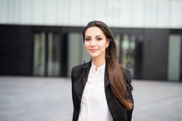 Wall Mural - Smiling businesswoman in a city