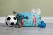 © New Africa - Bag with different sports equipment on wooden floor indoors
