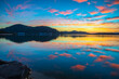 © Merrillie - Sunrise waterscape with high cloud and reflections