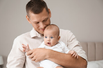 Sticker - Happy father holding his cute baby at home