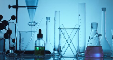 Wall Mural - hand scientist shaking erlenmeyer flask with chemical liquid, scientific equipment and science techn