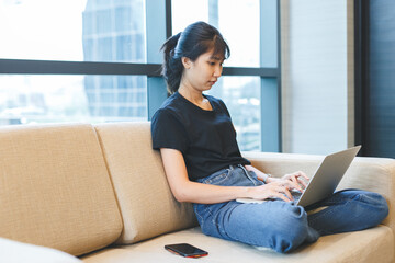 Poster - Asian young woman working with laptop from home, freelance work job.