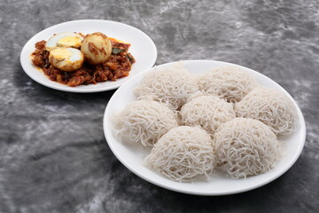 Kerala meal- delicious idiyappam , string hoppers, served with spicy egg roast curry, 