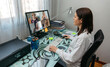 © David Pereiras - Woman talking on video call with computer with her friends