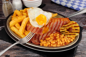 Wall Mural - Grilled gammon egg and chips meal with baked beans and pineapple fruit ring