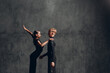 Couple in black dress dancing in ballroom dance rumba