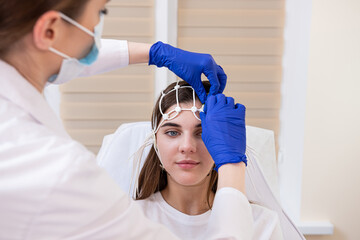 Patient brain testing using encephalography at medical center