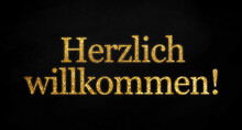 Black Background With Golden Glittery Letters Showing The German Word For Welcome - Herzlich Willkommen