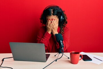 Sticker - Beautiful middle age woman working at radio studio with sad expression covering face with hands while crying. depression concept.