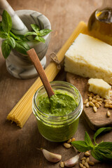 Canvas Print - traditional italian pesto with raw spaghetti and ingredients