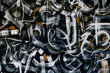 © SerPak - Abstract background with brush strokes on the wall. Hapster back with graffiti and painting.