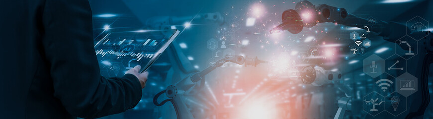 Wall Mural - industry engineer in factory,using smart tablet glass device,control automated robot arm machine lea