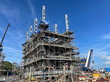 Project building construction of a natural gas refinery or a fuel refinery.