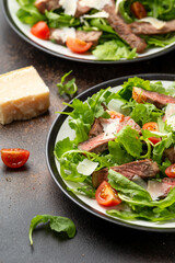 Wall Mural - Italian Beef Tagliata salad with wild rocket, cherry tomatoes and parmesan cheese